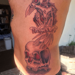 Poe themed #raventattoo with #skull and #nevermore in #steampunk style by #theartofchloecarter on my left side #EdgarAllanPoe #sidetattoo #ribtattoo 