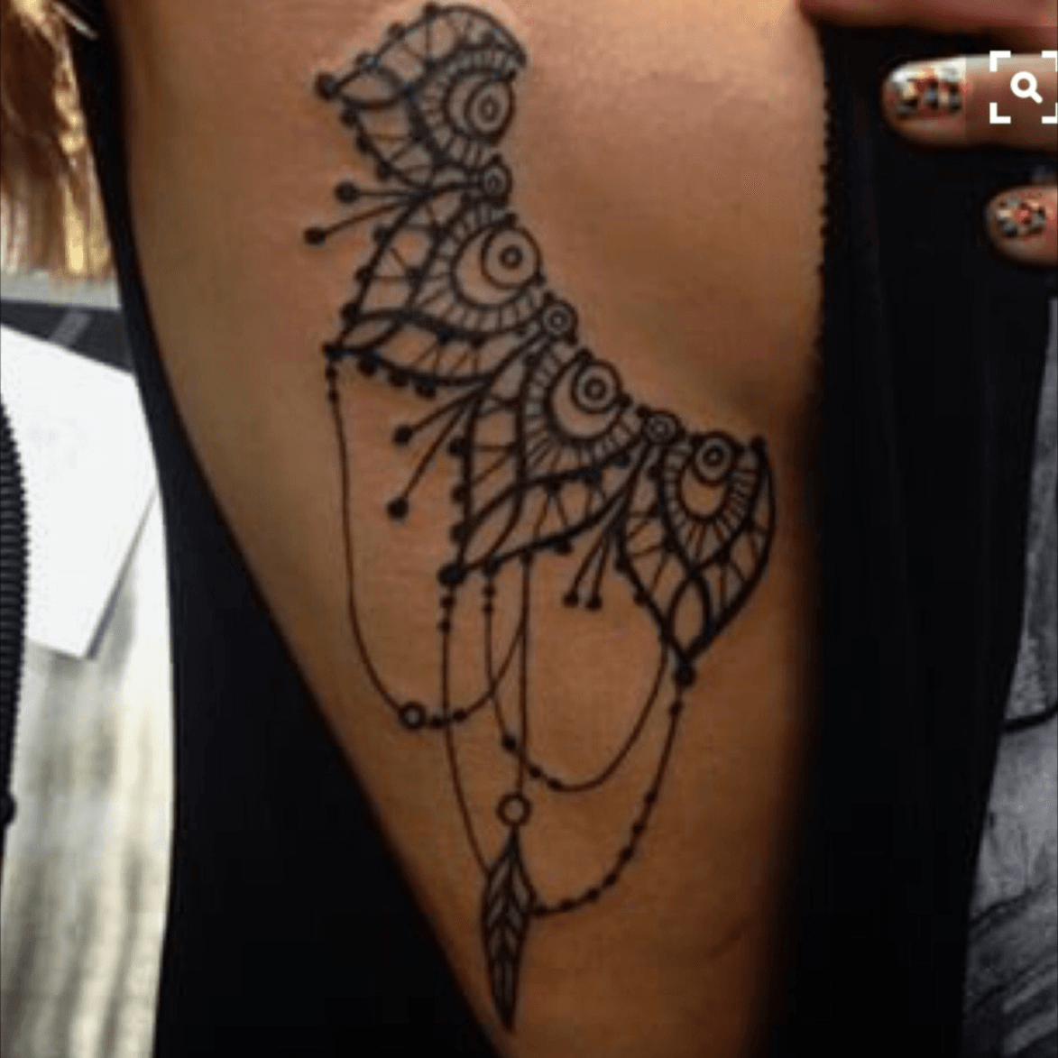 Side and under boob tattoos are all the rage