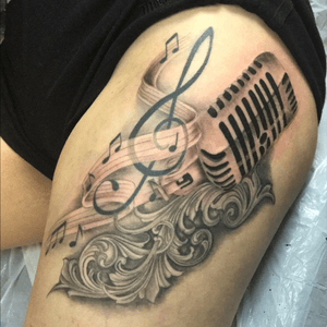 Music inspired black and grey thigh tattoo #music #musictattoo #blackandgreytattoo #Musictattoos 
