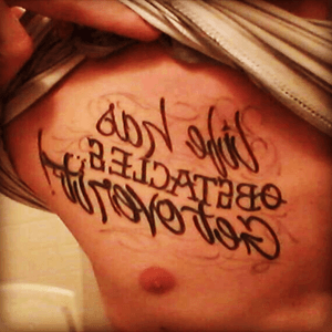 (Life has obsticales get over it) curtousy of Voodoo tatoo in Ohio got this done when i was going through a tuff time in my life helped me keep pushing forward 