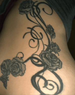 this tattoo is a tribal with roses the finish is not successful to perfection it covers my left side