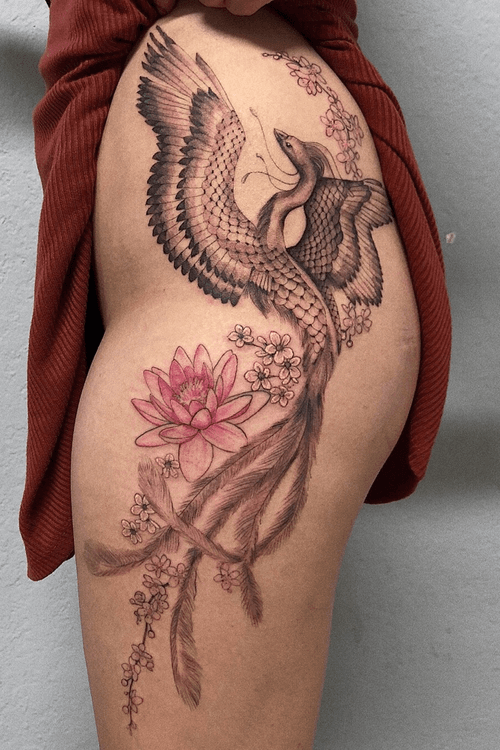 Delicate phoenix with a waterlily, plum blossoms , and tufted saxifrage 🔥🌸🔥                                            #phoenixtattoo #phoenix #floral #fineline #tattooartist #tattoodo #thightattoo #ornamental 