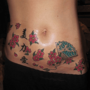 Cherry blossom stomach tattoo by Gabriel "Big Gabe" Bayles at Scorpion Studios in Houston, TX. #cherryblossom #kanji #stomachtattoo #femininetattoo #Tattoodo 