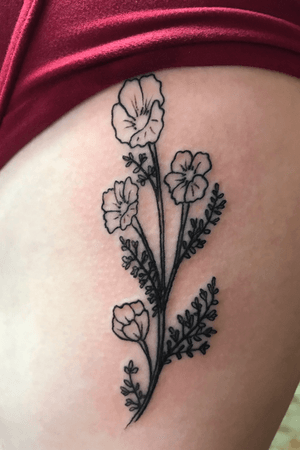 Poppy flower tattoo on ribs by Benja at Universal Rites Tattoos in Ashland Oregon.