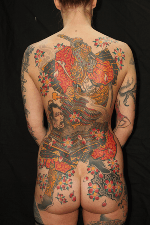 Stunning back piece featuring sakura, sword, samurai, namakubi, and cherry blossom motifs by renowned artist Stewart Robson.
