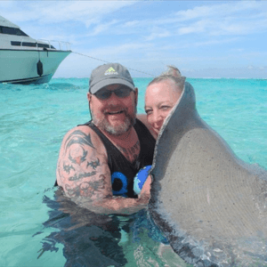 My wife and I on Grand Cayman checking out the rays.