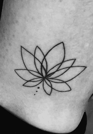 Minimalist lotus tattoo
