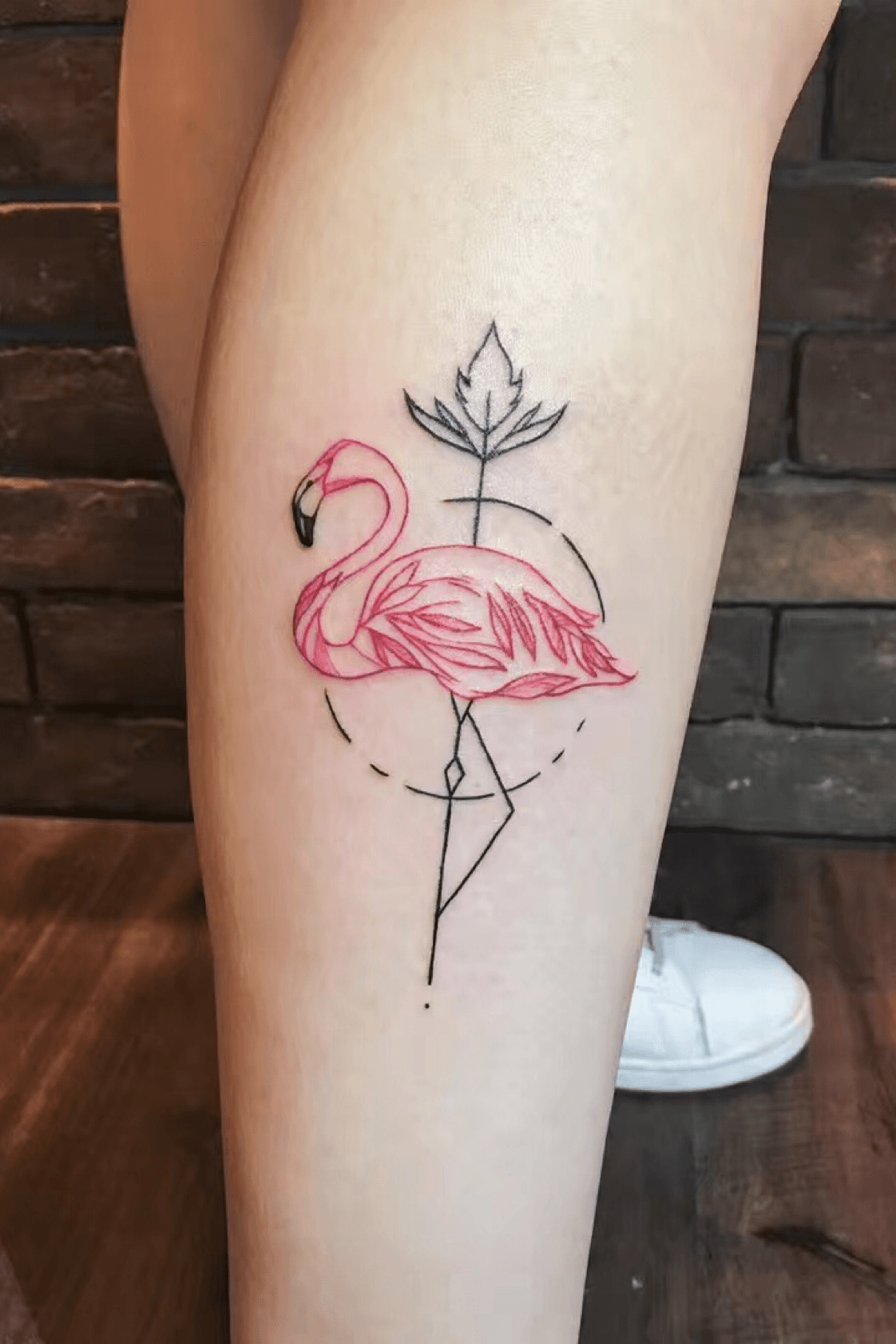 Neotraditional flamingo tattoo on the left calf