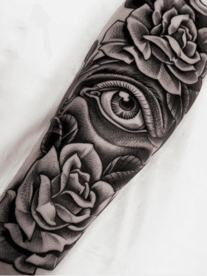 Eye and roses on inner forearm 