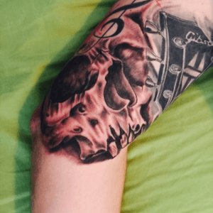 Partial Skull on my half sleeve #tattoo #skull #gibsonguitar #musictattoo #rockandroll 