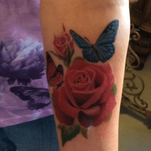 My new tattoo in memory of my mum and dad 🙏😇roses with a 2 butterflies to represent them a pink one for mum and blue for dad Awesome job done by Adam at Darklite tattoo Studio,Albany Western Australia 
