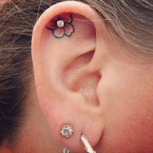 #pretty #flower #floral #innerear #pink flower with a stud #welove 