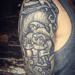 A woodcarving tattoo of Tor wrestling Ellie (Old age) 
