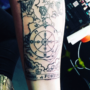 Wheel of fortune tarot card tattoo by canada at dr. Jacks ink emporium. Omaha, NE 