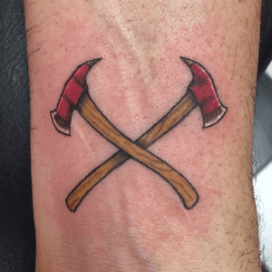 crossed fire axes tattoo