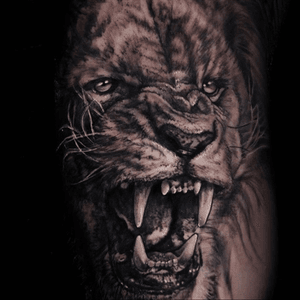 Lion tattoo... Really dig this one, want one morphing into a girl on the ribs. #futuretattoo #dream #ribs #ribcage #lion #animaltattoo #realistic #realism #blackandgrey 