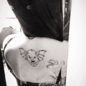 My tattoo artist logo on my upper back. Thought he was cute #logo #tattooshop #devil #batwings 