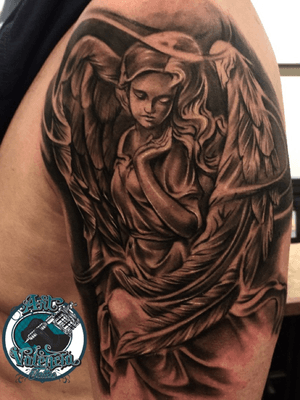 Angel statue tattoo 