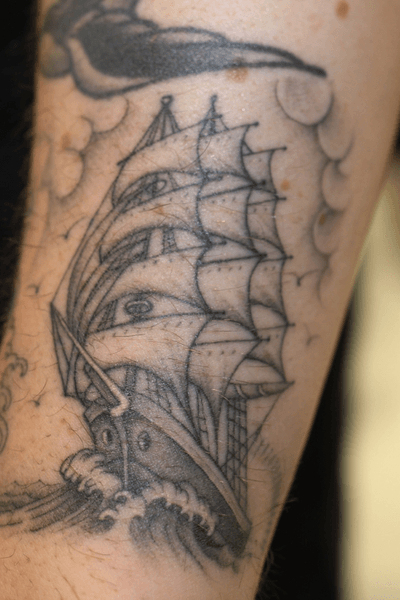 Get lost in the sea of clouds as you sail through life with this stunning blackwork tattoo on your arm. By Stewart Robson.