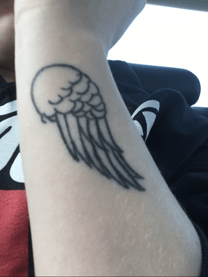 Angel wing on side of wrist 