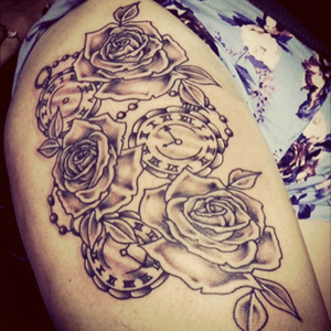 Roses and clocks intwined together #thigh #tattoo #tattoo_art_worldwide #tattoo_artwork #greyshade 