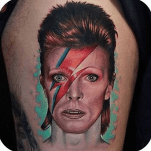 I've loved David Bowie since I was a kid and when he died in January of 2016 my life fell to shambles. Bad things were constantly happening. I was self harming again, I was suicidal again, The man I'd given four years of my life to and almost had his baby got engaged after using me a day before, my cousin passes away from cancer, and then my idol? I was in tears. But listening to David always made my heart a little lighter, and I still look up to him. I want to get this iconic portrait on my left upper arm with Traditional Styles so I can add onto it and eventually build a traditional sleeve.The problem is I know a GOOD portrait costs more than I can afford and I know I'll never get it done. #megandreamtattoo