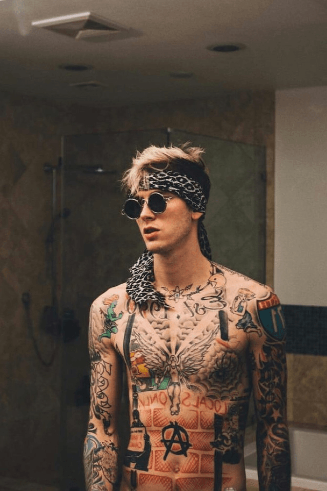 Machine Gun Kelly Changes Album Name After He and Travis Barker Got It  Tattooed on Their Arms
