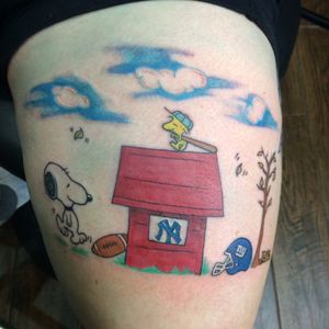 A snoopy tattoo done by Big Joes in White Plains NY