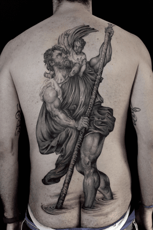 Stunning black and gray illustrative back piece by Stewart Robson featuring a man with a beard holding a child, capturing the bond of a father and son.