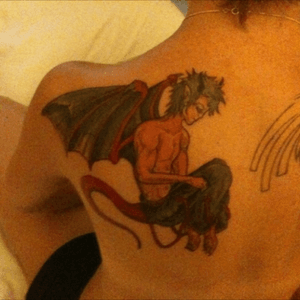 A humanoid male dragon on my left shoulder 