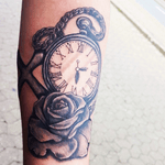 Pocket watch, rose and a cross.