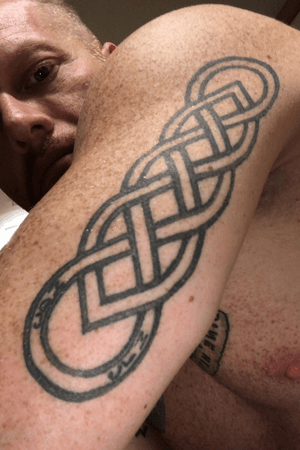 2014-This is a Celtic Dual Infinity Knot done by Red Dragon Tattoo in Cork City, Ireland. The initals on the bottom are MLC and MDC for my deceased grandparents.