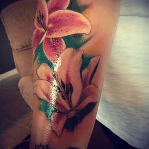 Two lillies ro represent my mother and my mother in law who passed away last year.  The smaller one below that is a infinity symbol with mine and my best friends birthstone colors. 