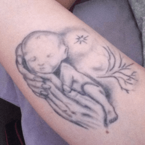 My baby boy Paul, in the hands of an angel. This is my favourite tattoo, paul was born asleep in 2011, so i had this done on my inner arm to keep him cuddled into me, and close to my heart forever. 💙