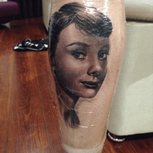 Audrey Hepburn realistic portrait (freshly done on the pic) ✨ Made by Ryan Evans (London,UK)  at Brighton Tattoo Convention.#audreyhepburn #realistic #portrait #blackandgrey #blackandgreytattoo #amazing #Tattoodo #actress #calftattoo #calf #love 
