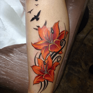Lillies and birds symbolizing loved ones lost