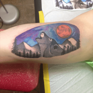 First tattoo, had no idea the addiction i was headed for. #wolftattoo #wolftattoos #watercolor #wolf #northernlights #moon #first #firsttatoo #blacandgrey #mountains #trees #forest 
