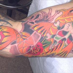 Traditional koi with skull and rose.
