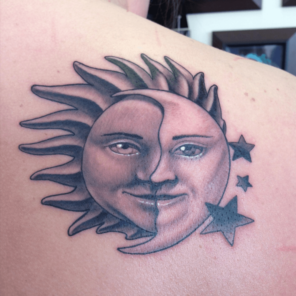 half moon face tattoo