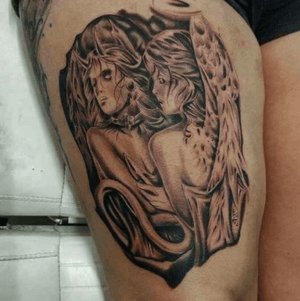 My angel and demons tatoo in front of a thigh