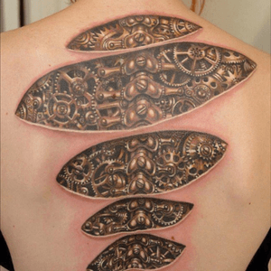 Steampunk style spine tattoo #steampunk #cogs #machine 
