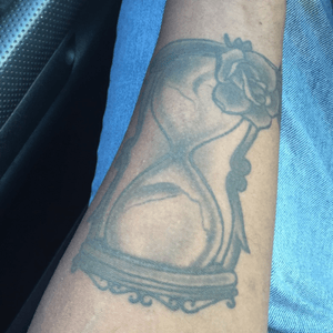 An hourglass with a a rose to remind me that life is short and that i should live it to the fullest.