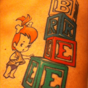Tattoo for my daughter. She looked just like Pebbles when she was little.