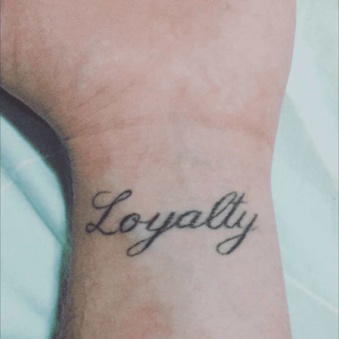 Tattoo uploaded by Travis  Loyalty and respect words to live by Respect  loyalty wristtattoo  Tattoodo