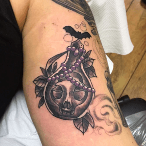 Inner bicep ( arm) potion bottle with cat skull for filler. Was a tricky spot and ended up hurting rather bad but i love it!  Covered stretchmarks nicely. #upperarmtattoo #innerarm #potion #blackandgrey #blackandgreytattoo #witchtattoo #witchcraft 