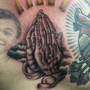 Pray hands on his middle chest... Done by:Manny