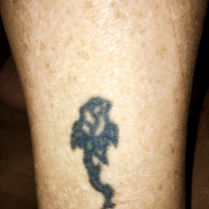 My first tattoo 1991!  Used to be a dark green stem and purple rose 