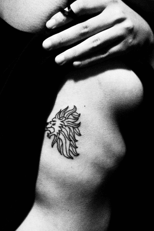 This is a fine line tatoo I designed with the profile of a lion with mane that is meant to look like the suns rays. There is a fable of the sun and the cloud that my mother used to tell me about how an aggressive solution is not always the most optimal. I have this tattoo to remind me that I can still be powerful and revered by just shining from within (Tattoo #1- Sol Lion)