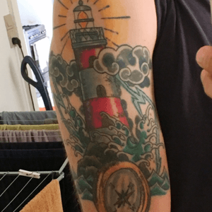 Traditional lighthouse tattoo. Done by #GuyNeutron at #lovehatelondon in 2014.
