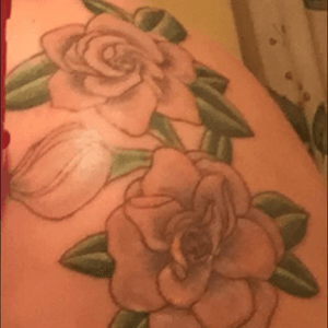 My least fav tattoo. Supposed to be Gardenias. 